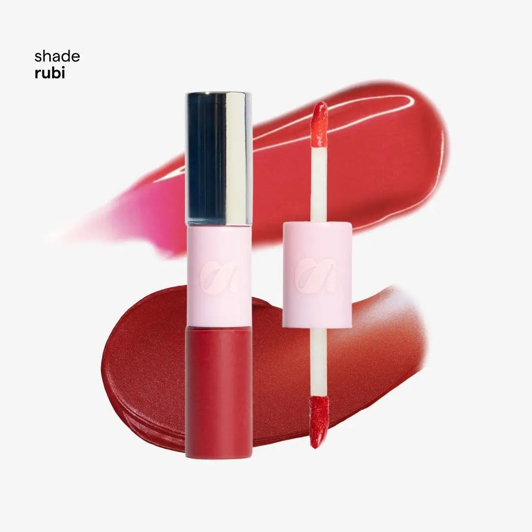 Tono Rubi liquid lipstick in a deep berry red shade, shown with the tube closed and the applicator wand open. The product is set against a white background with two glossy lipstick swatches in matching shades of red and pink, and the text 'tono rubi' is visible in the top left corner.