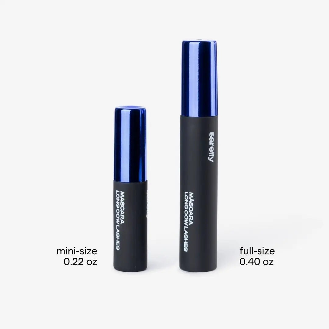 Two black cosmetic tubes with metallic blue caps on a light gray background, labeled mini-size 0.22 oz and full-size 0.40 oz