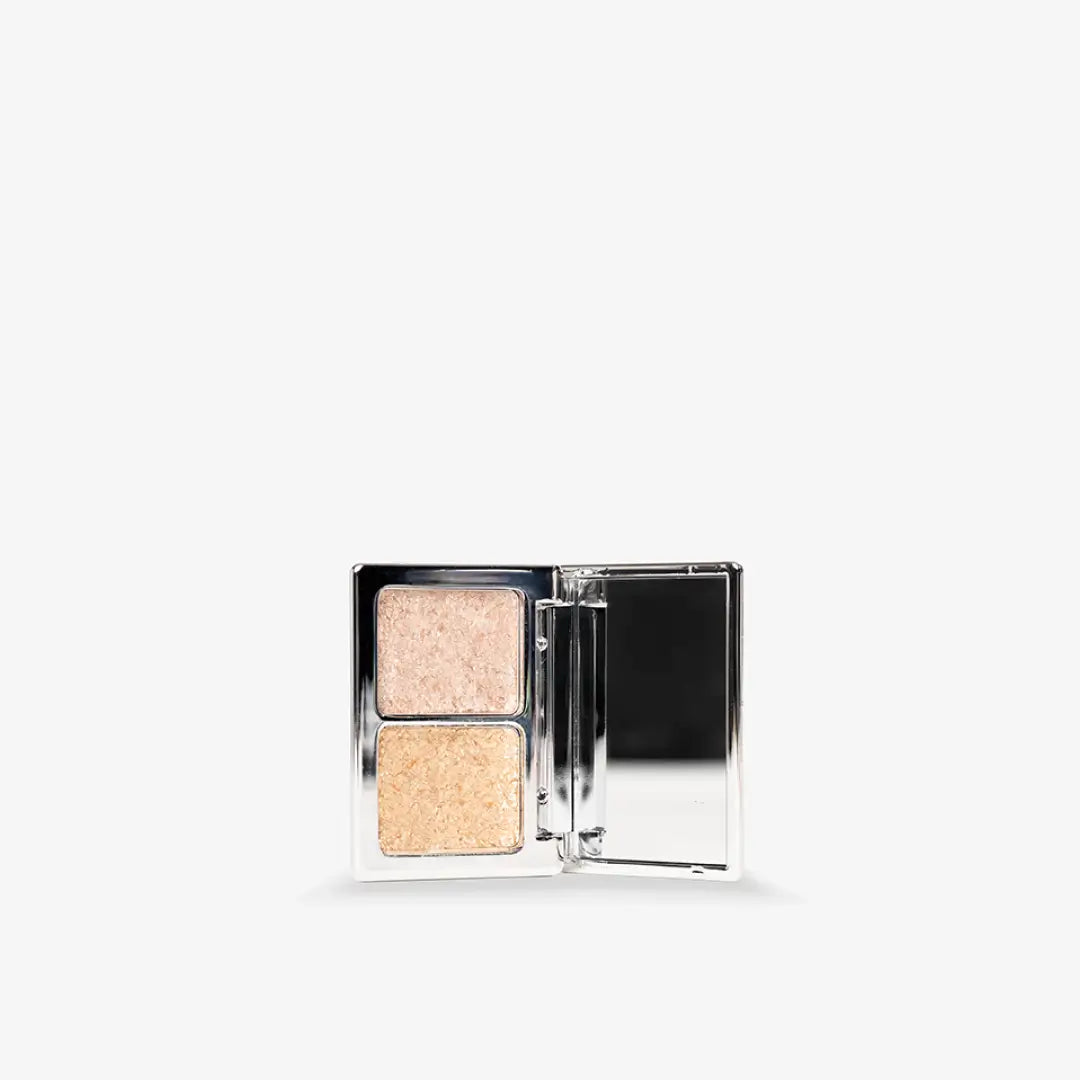 Makeup product with two beige shades in a compact case on a white background Creamy Sparkle Duo